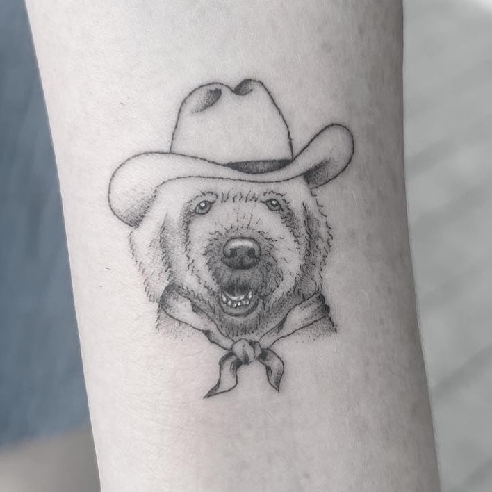 Horse with flowers tattoo on arm