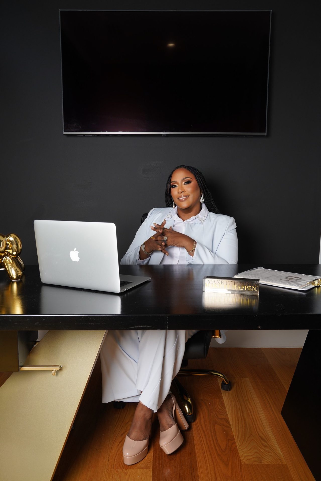 Dr. Lynda A. Barnes seated at her desk