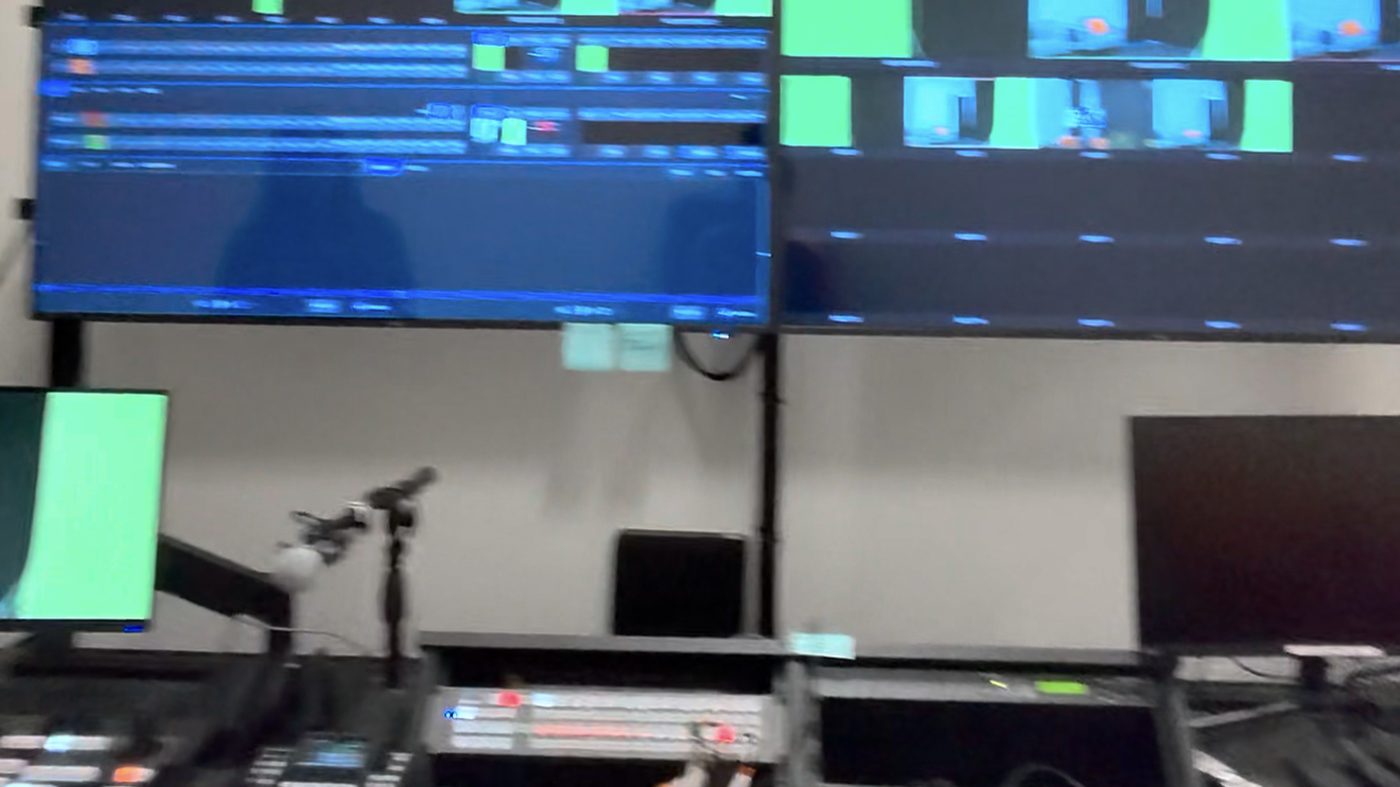 Control room with vision mixer, audio desk and multiview monitors