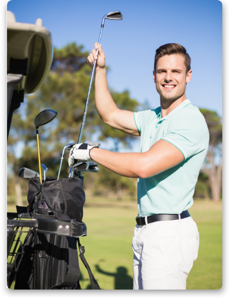 Man smiling while taking a golf club from his bag, demonstrating golf mental game tips and improving golf focus.