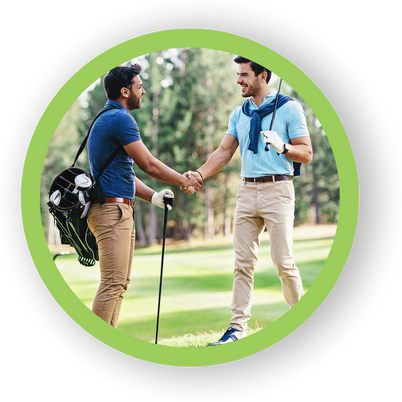 Two men shaking hands and smiling, symbolizing golf club mental training programs and golf mental coaching sessions for holistic player improvement.