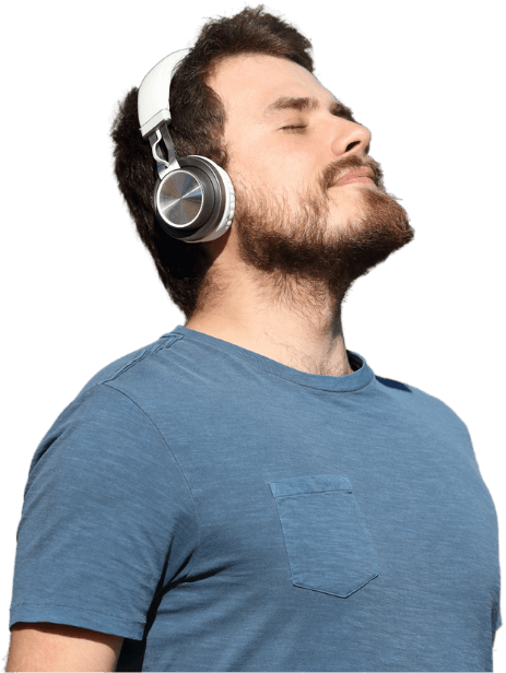 Man wearing a headset listening to guided hypnotherapy audio for subconscious mindset reprogramming and mental clarity support.