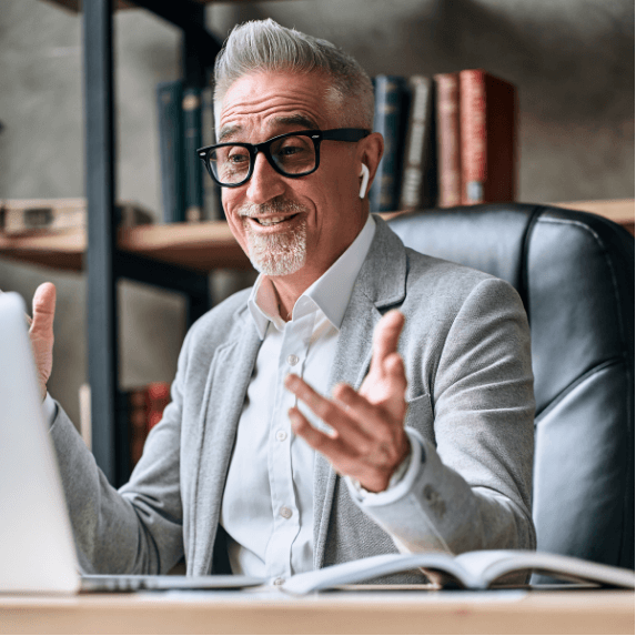 Professional man smiling during a 1-on-1 Biko Method session, experiencing emotional healing and mental clarity in a transformational coaching session.