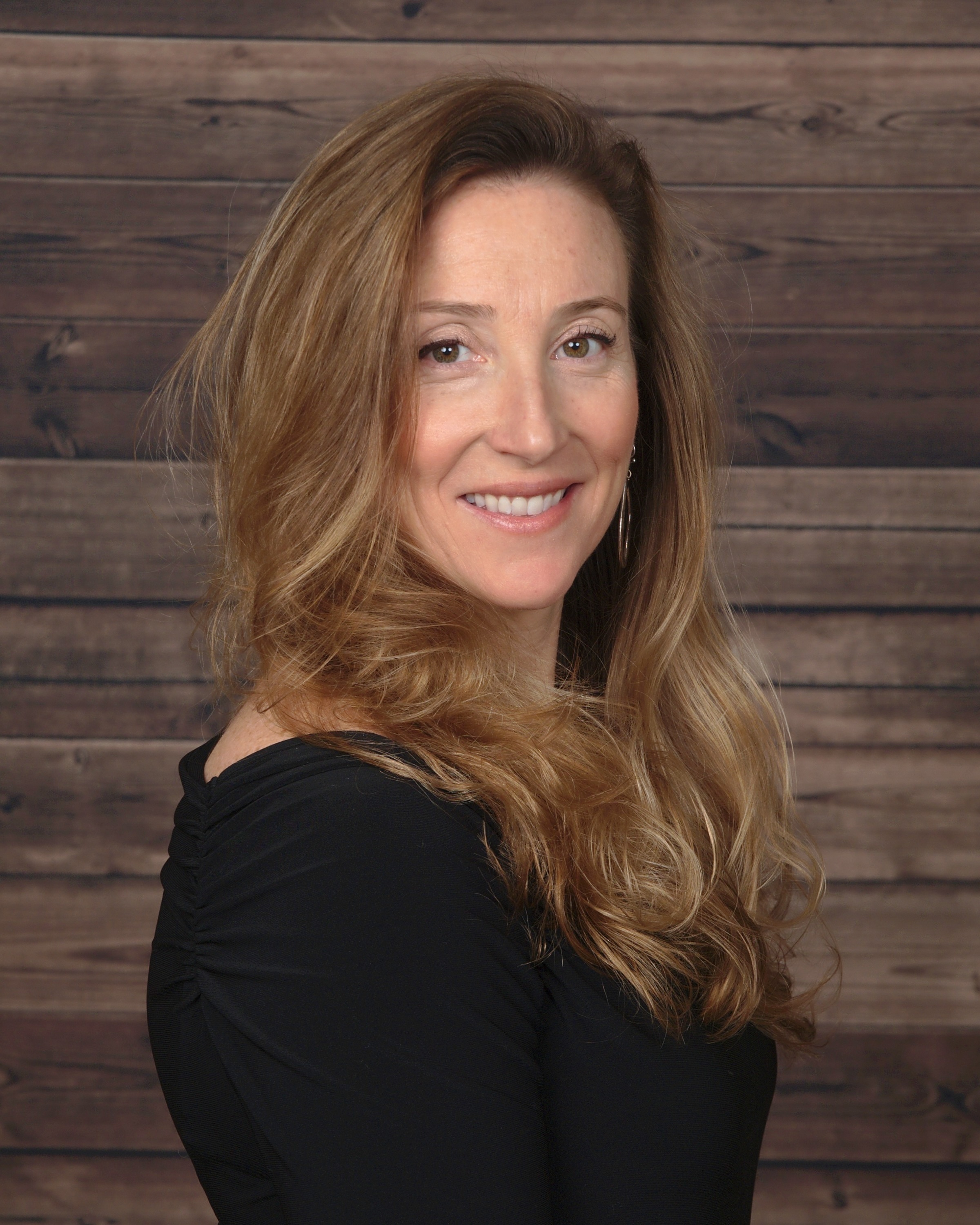 Sarah DeVido standing in professional attire