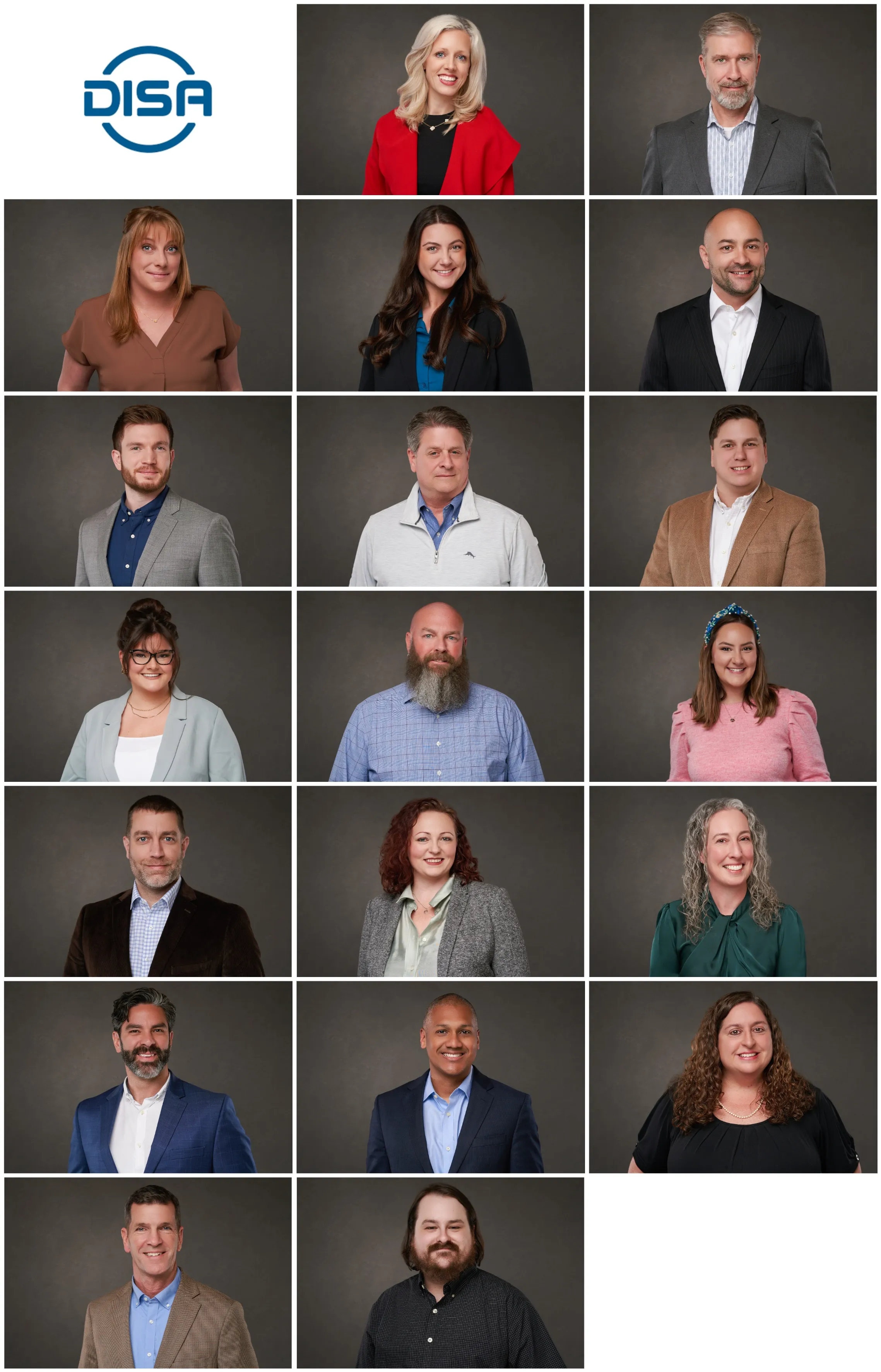 Team photo of a real estate firm composed of both males and females in professional attire