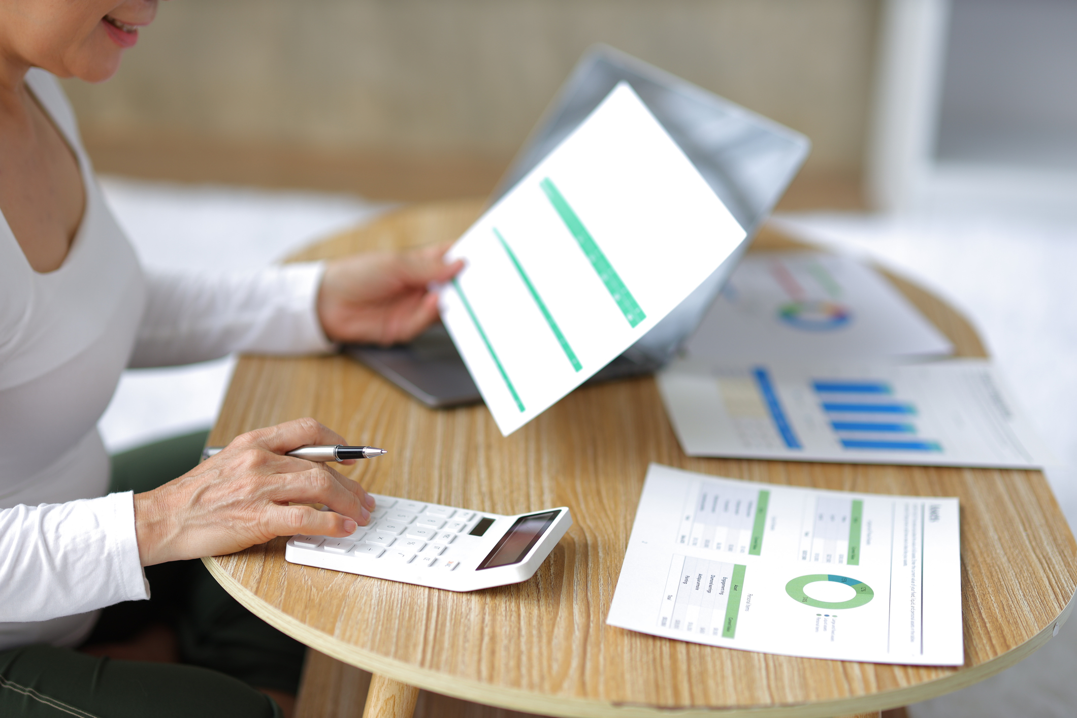 Reviewing a retirement income report with a calculator