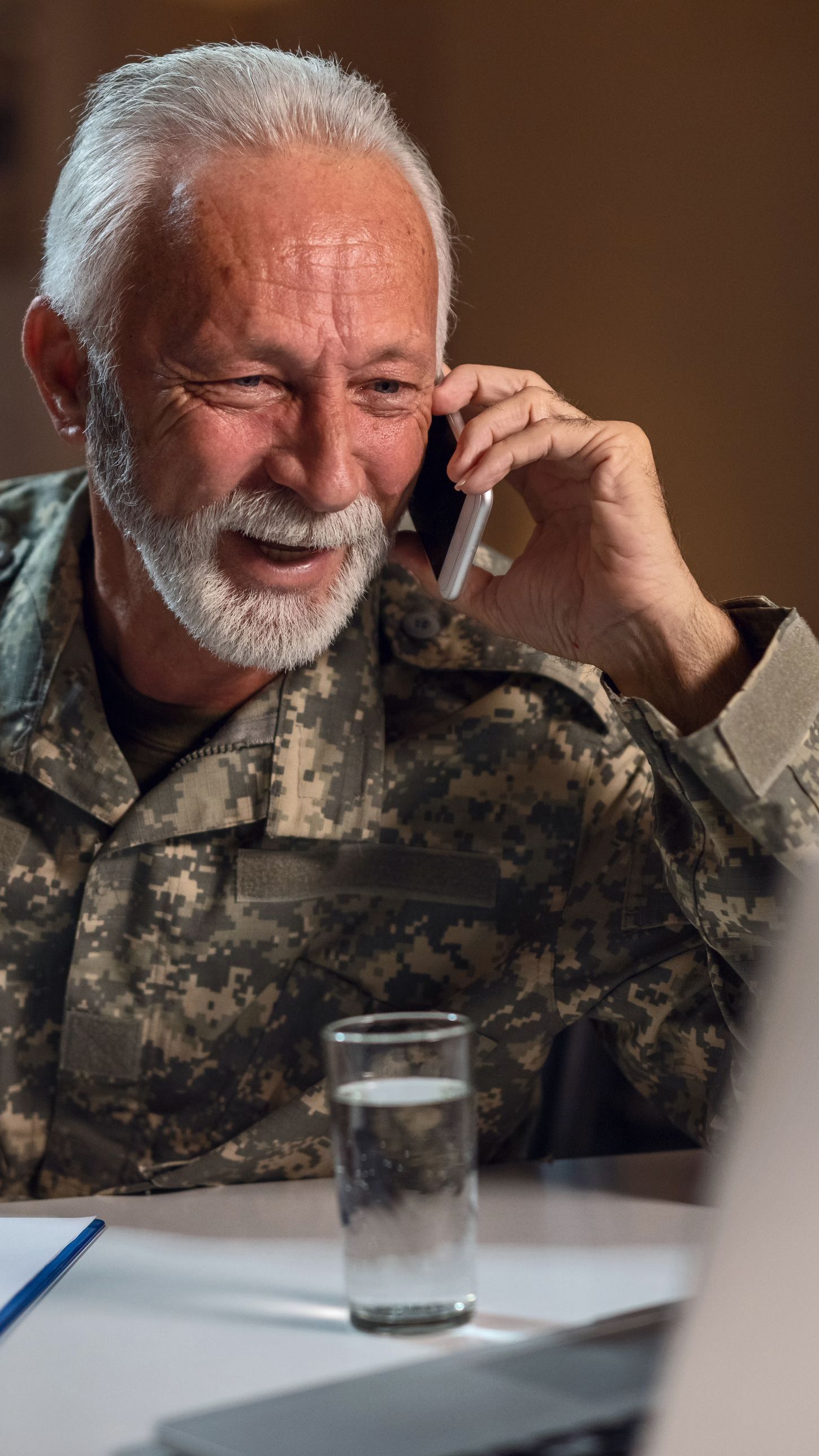 A retired service member on a phone call about his benefits