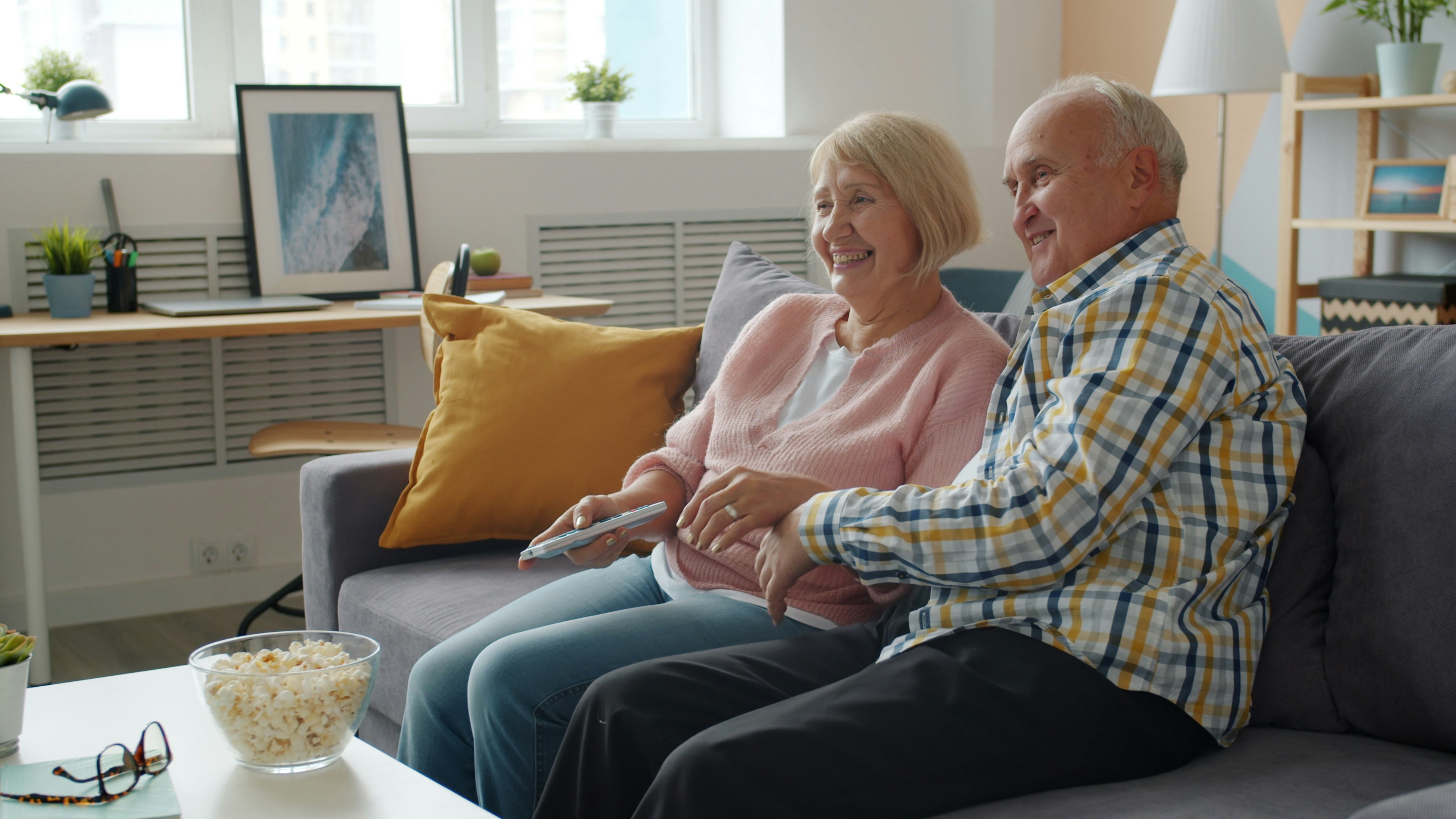 A retired couple going through their documents at home