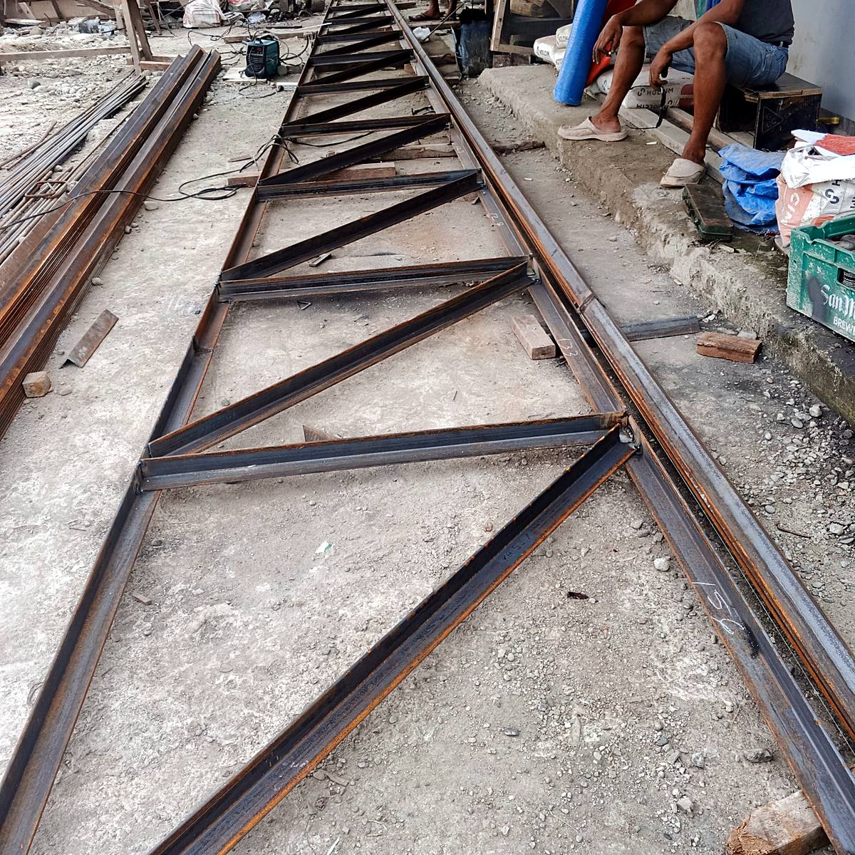 Steel roof truss fabrication on site — Triple J Builders