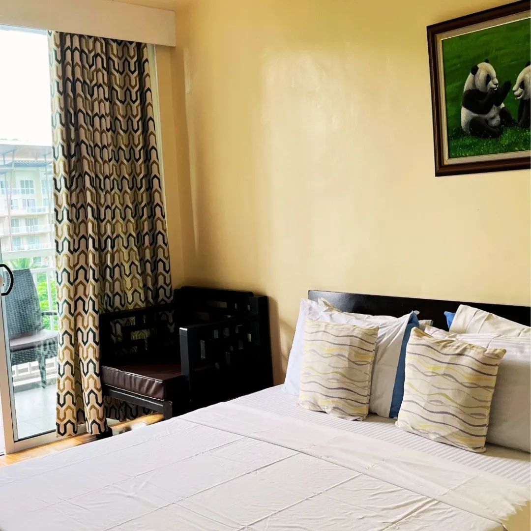 Bright bedroom with large bed
