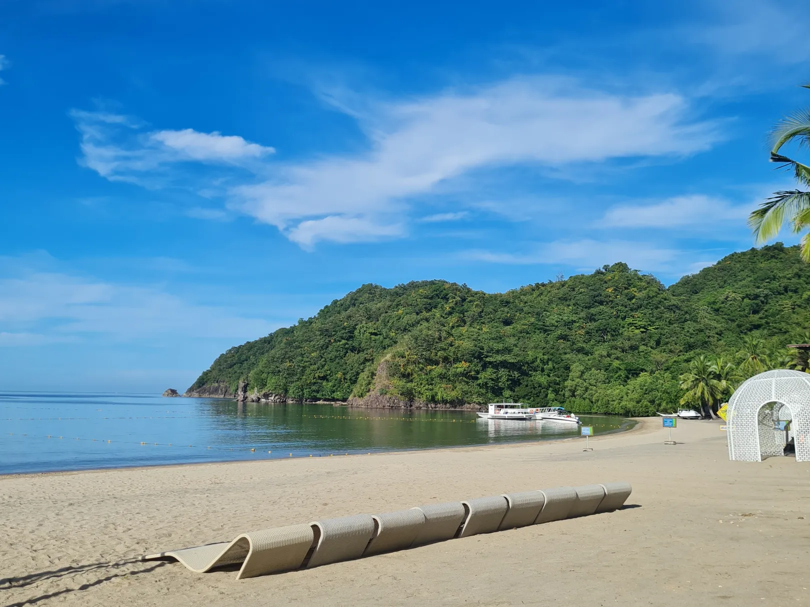 Pico Beach cove with calm water and green hills