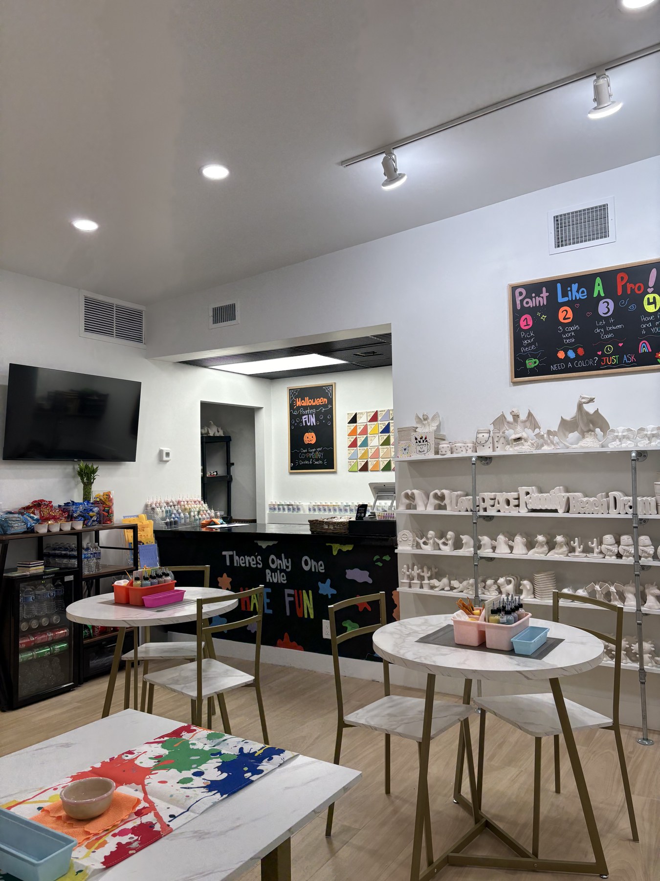 Halloween pottery and colorful paint station at the Delray studio