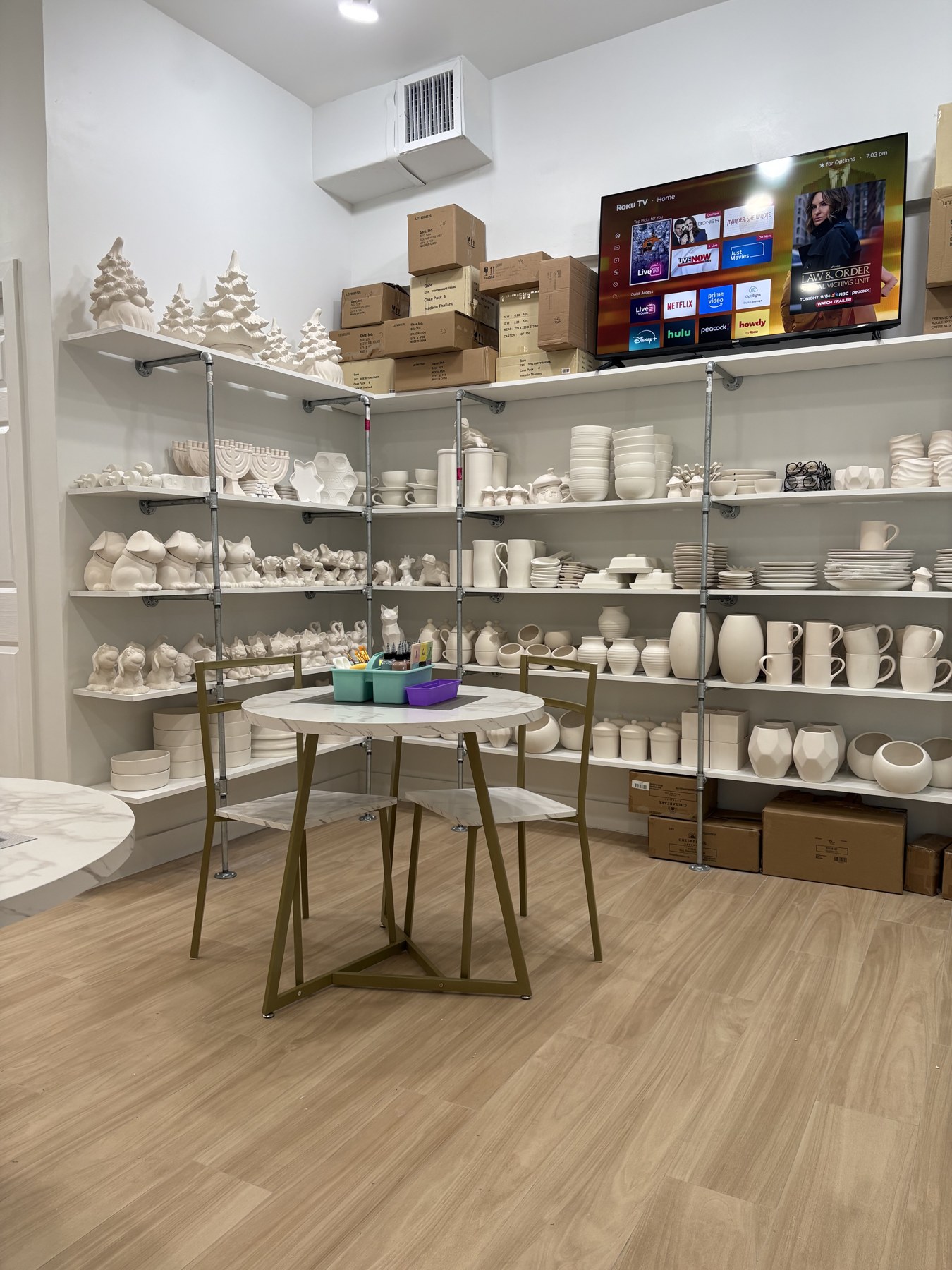 Shelves of Christmas pottery, Hanukkah designs, and dinnerware