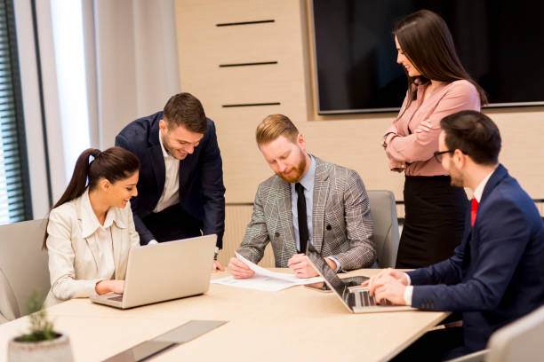 Managers reviewing workplace documentation together