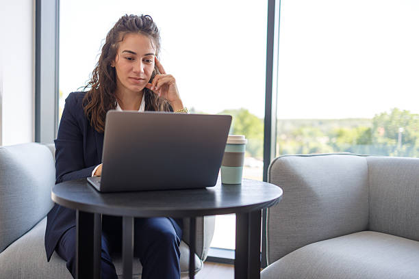 HR adviser working at a laptop
