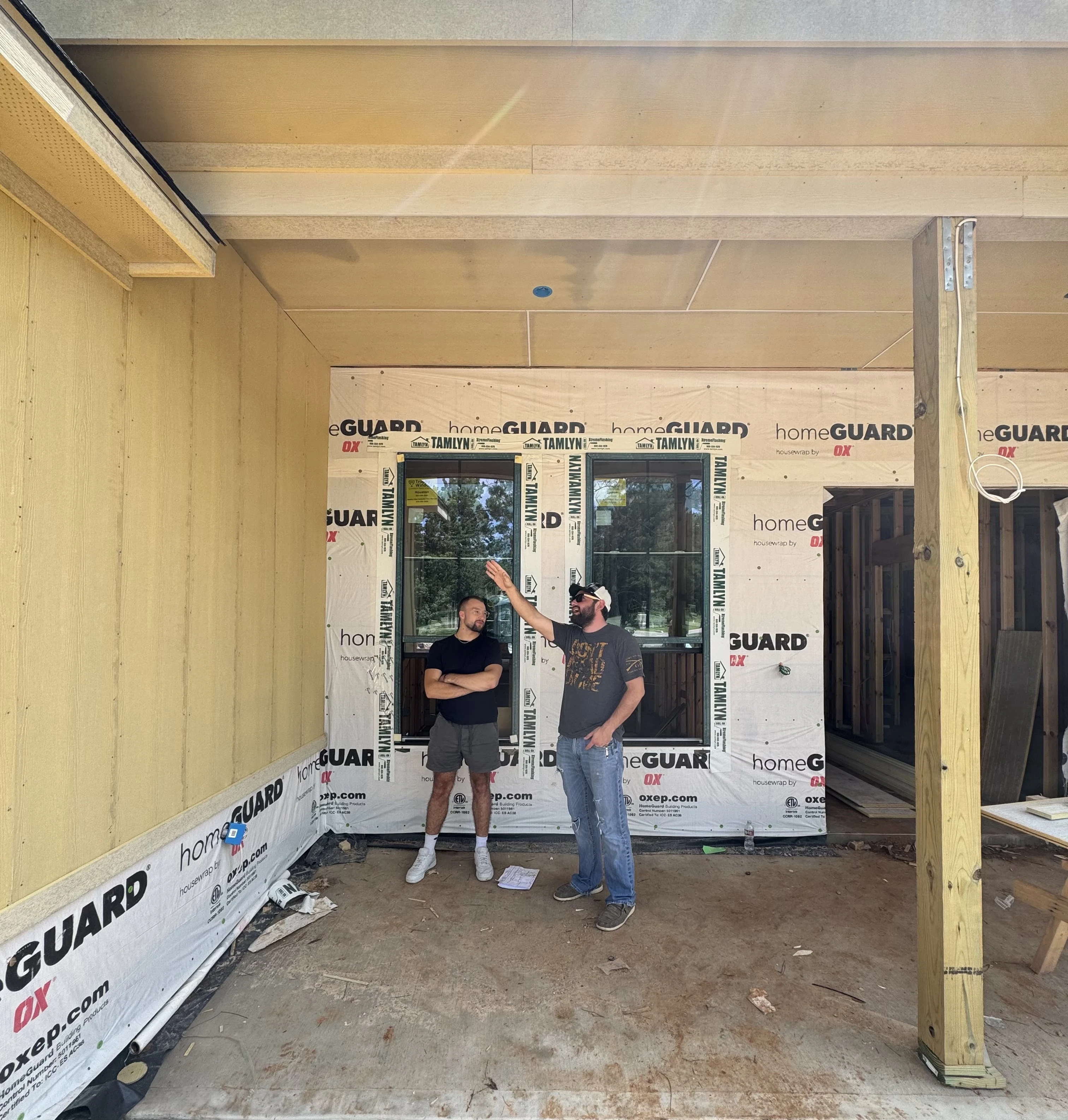 Dustin discussing construction details inside a home in progress