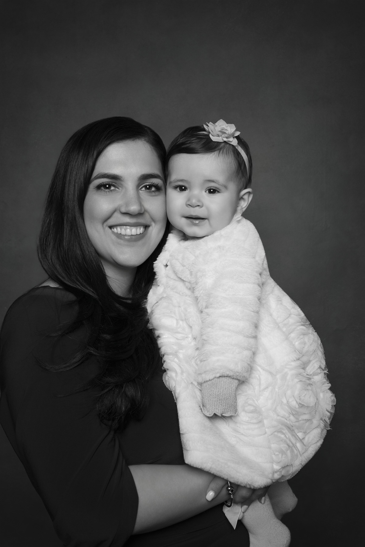 Mother and daughter photographed together during a black and white wedding portrait experience Mother and daughter photographed together during a black and white wedding portrait experience
