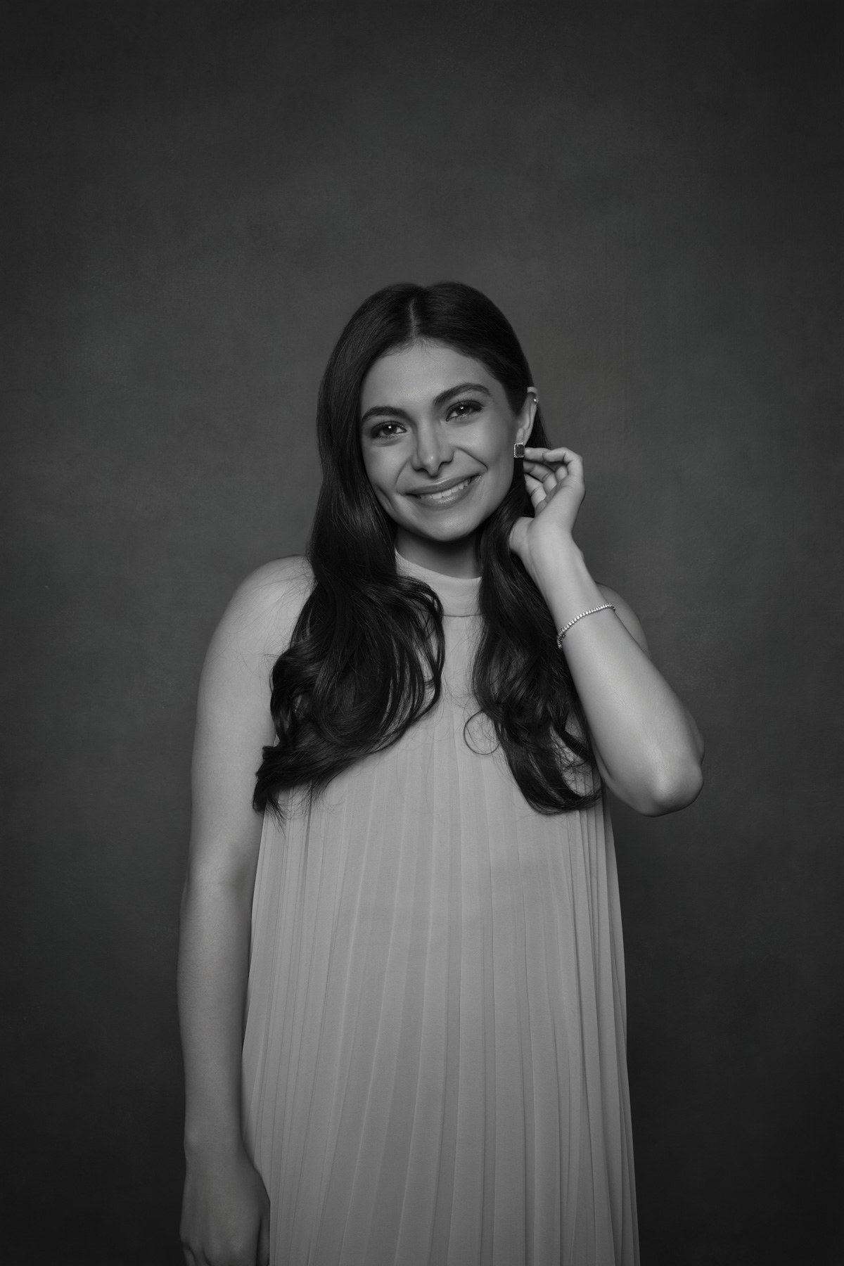 Fine art black and white portrait of a wedding guest photographed during a luxury wedding reception portrait experience. Fine art black and white portrait of a wedding guest photographed during a luxury wedding reception portrait experience.