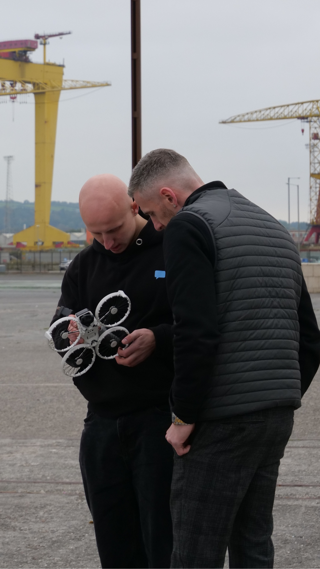 Adam talking through the plan with a client on site