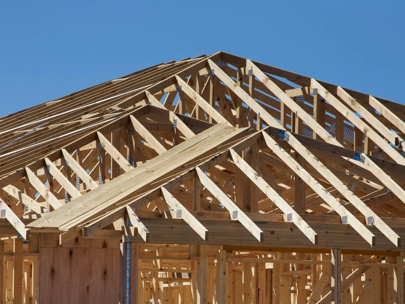 Roof truss framing on a home addition under construction in the Derry, NH area Roof truss framing on a home addition under construction in the Derry, NH area