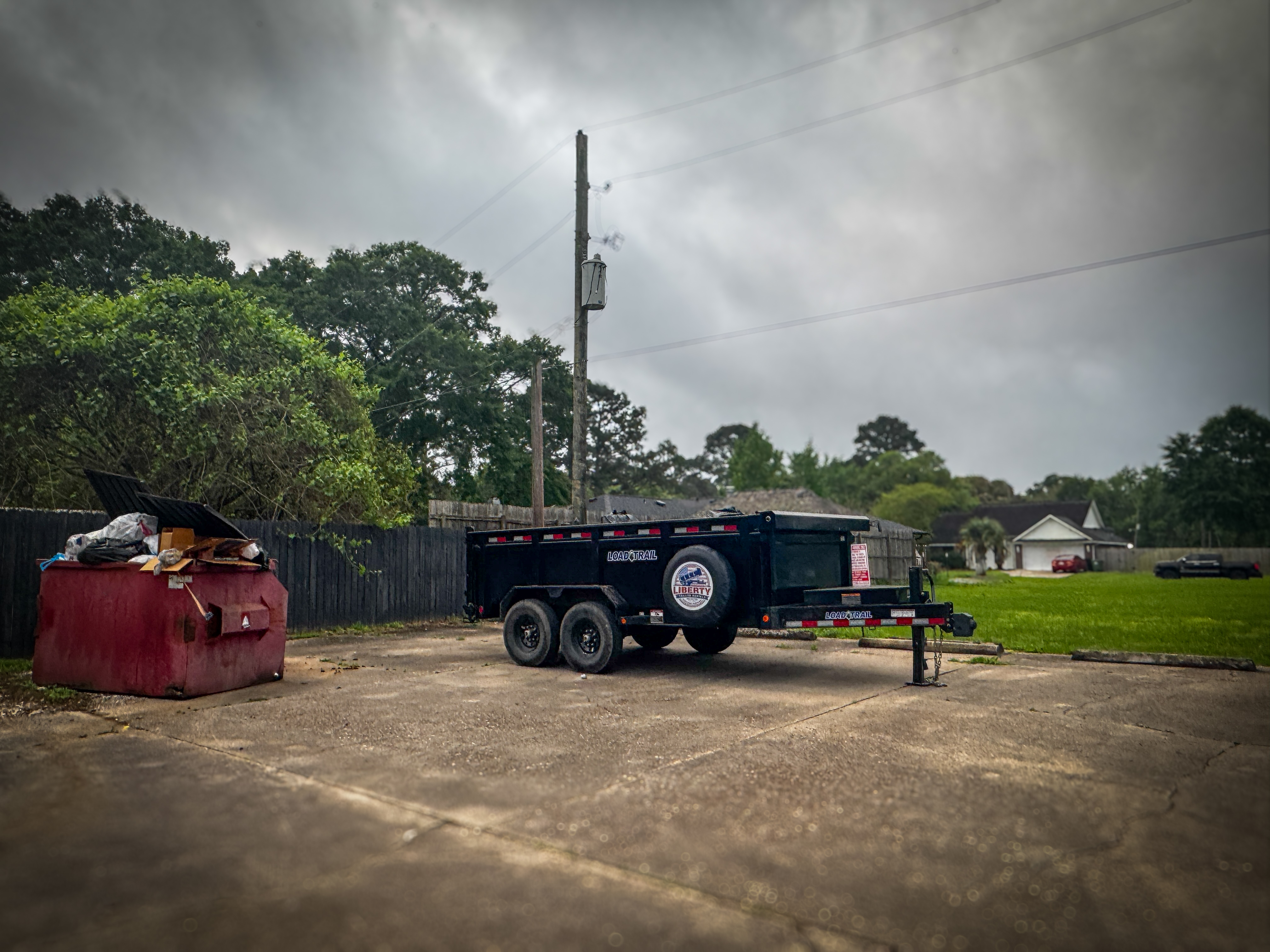 Dump trailer rental at residential cleanup job site in Liberty, TX