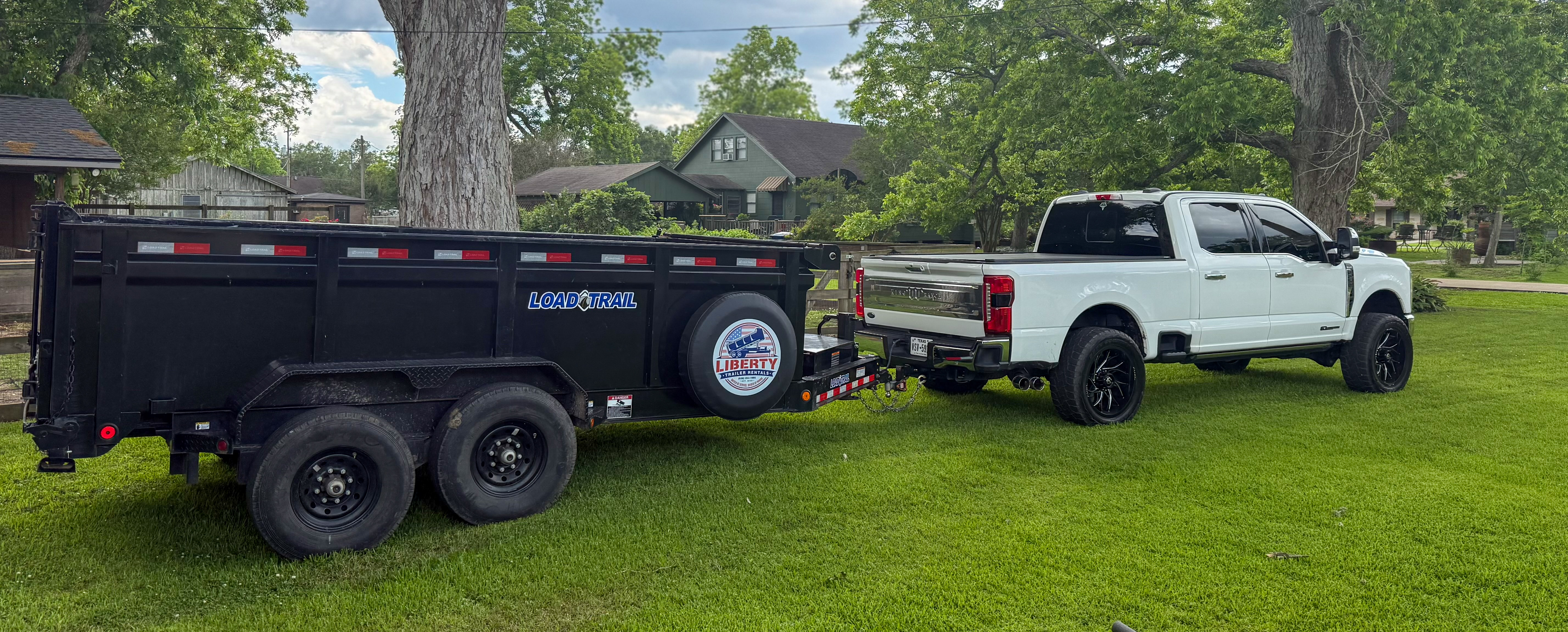 Dump trailer rental in Liberty, TX connected to pickup truck