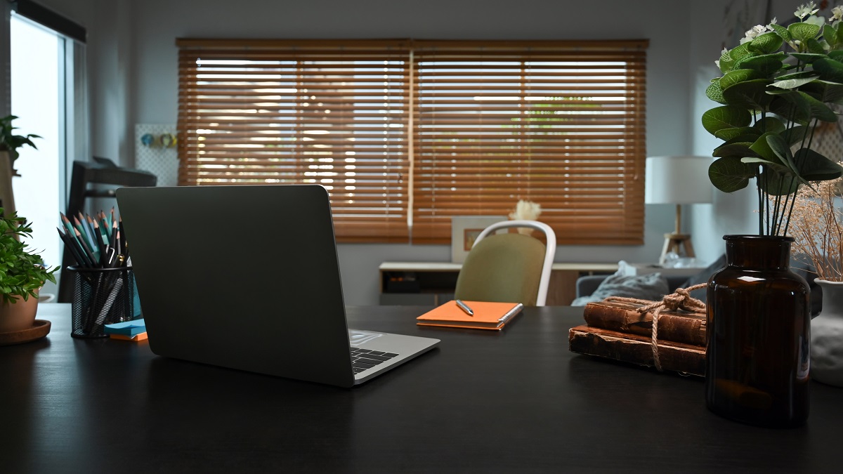 A darker office or meeting room with blinds closed.