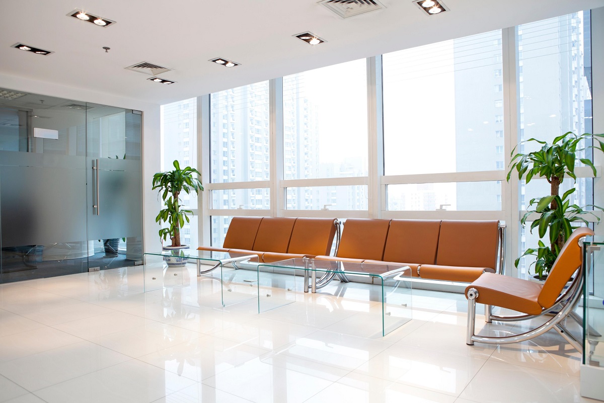 Clean commercial interior with tinted windows and natural light still visible.