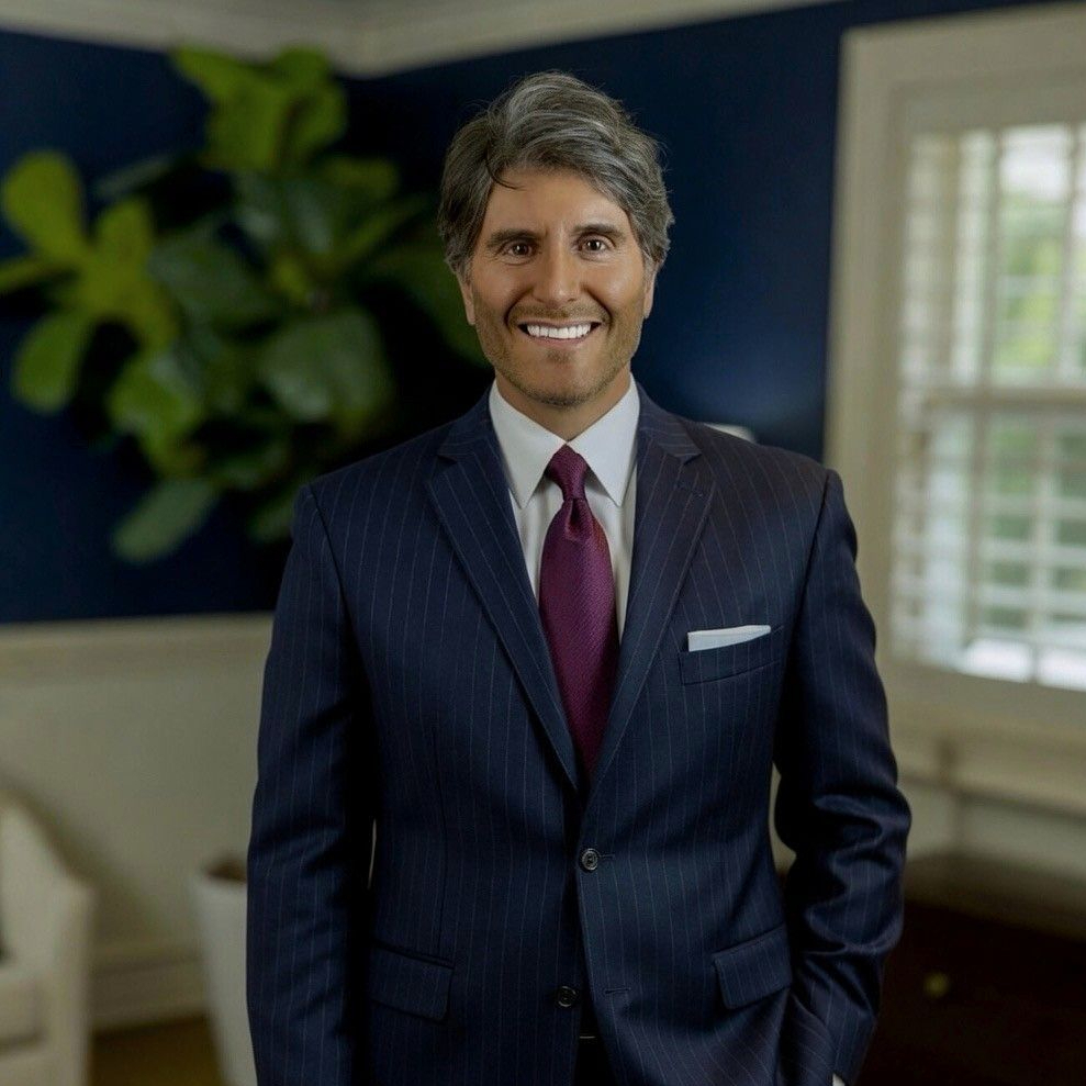 Anthony Olivieri III, CIC, Buell & Olivieri Co-Owner in professional attire.