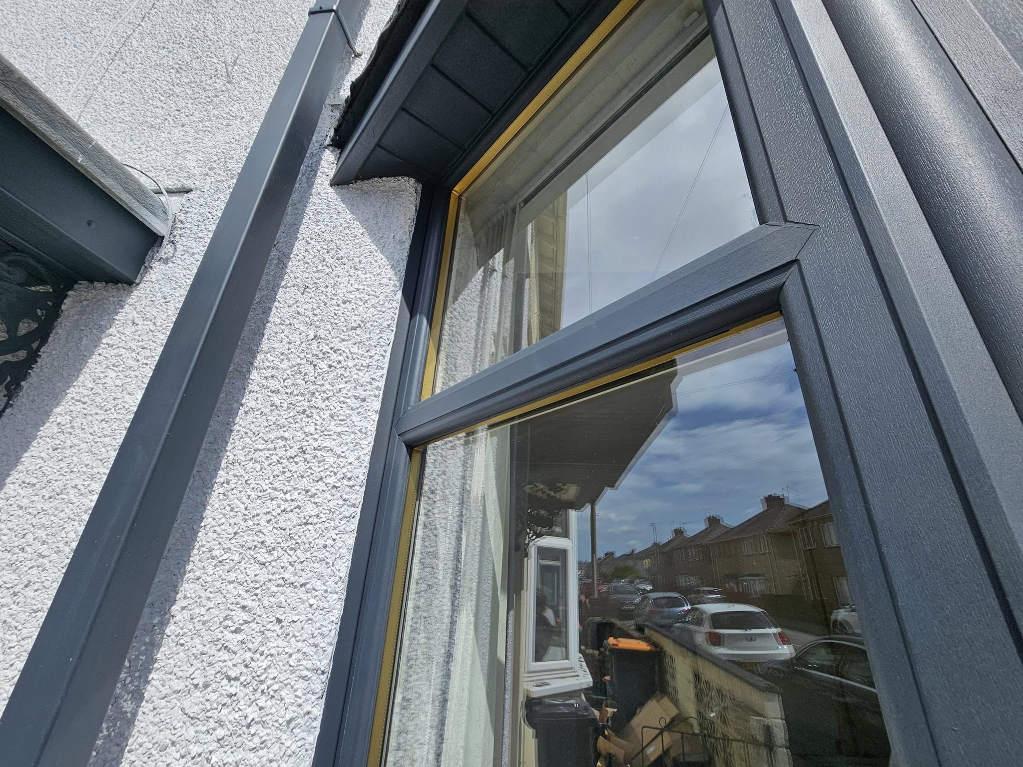 Freshly painted garage doors and window frames on 1930s semi-detached house in Gaer