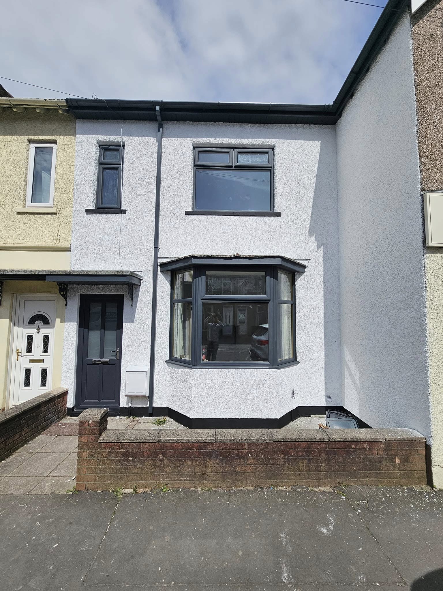 Complete exterior makeover of ex-council house on Cromwell Road, Newport with weather-resistant pain