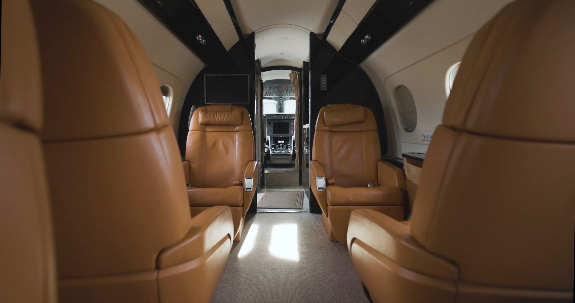 Private jet cabin with leather seating