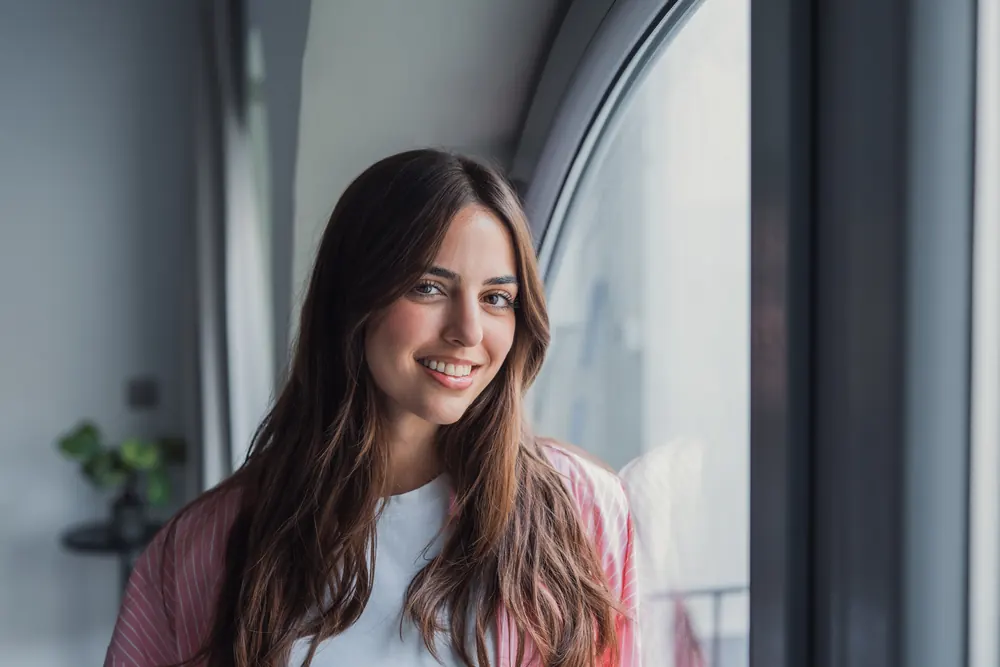 Healthy adult portrait in warm window light