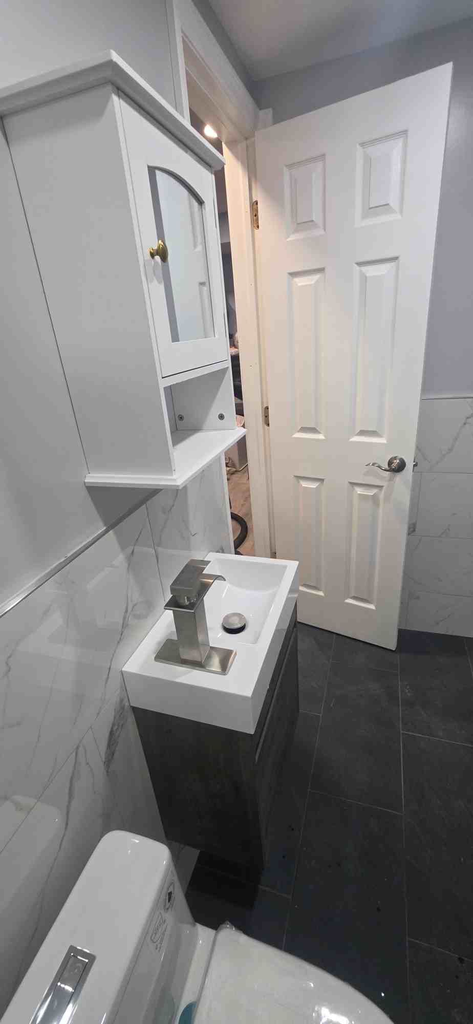 Bathroom remodel, new vanity and floor tile by Home Improvements by Joseph, after
