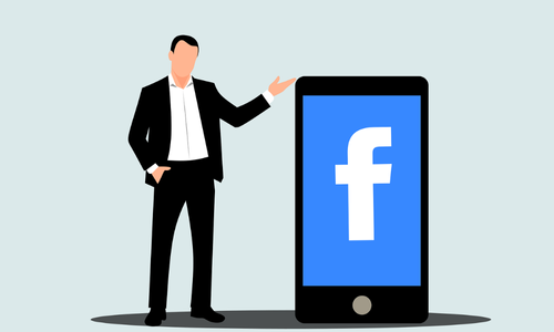 Illustration of a businessman in a suit standing beside a large smartphone displaying the Facebook logo, symbolizing social media marketing and brand presence.