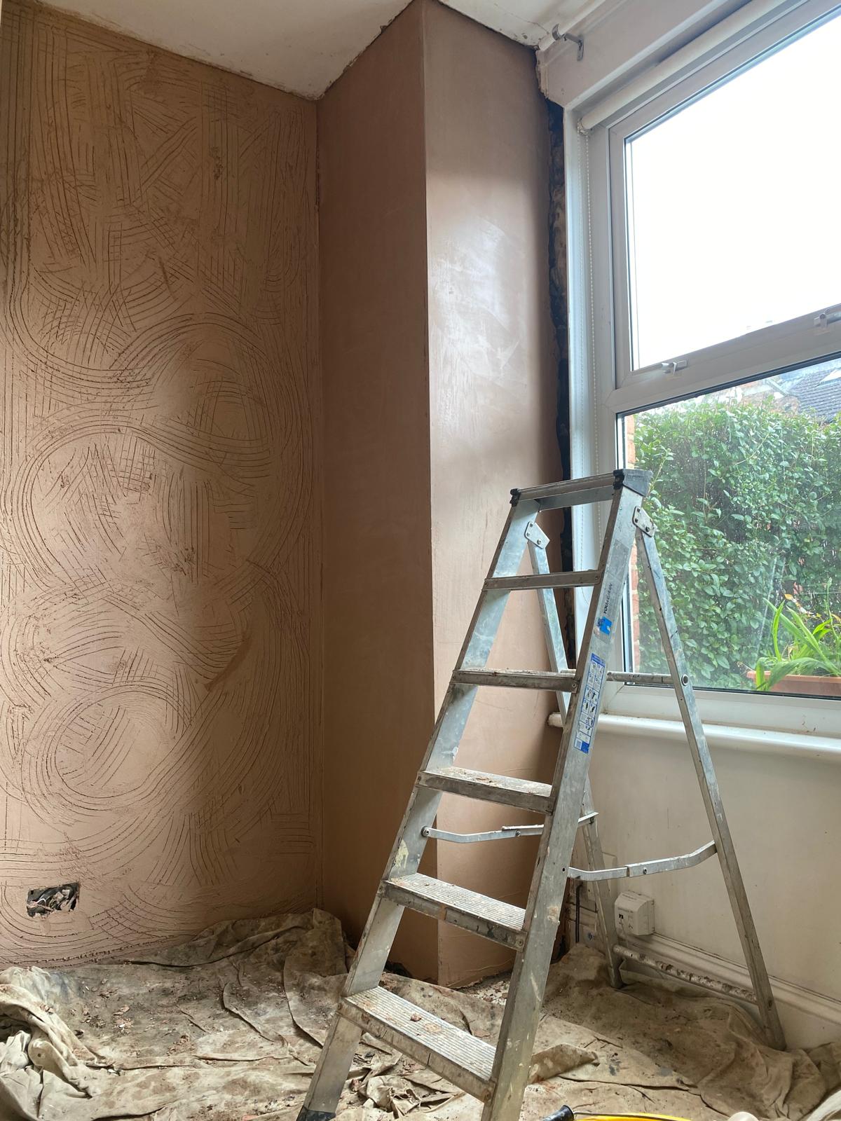 Keyed scratch coat across full internal wall in KT17 Epsom property, showing combed texture ready for brown coat