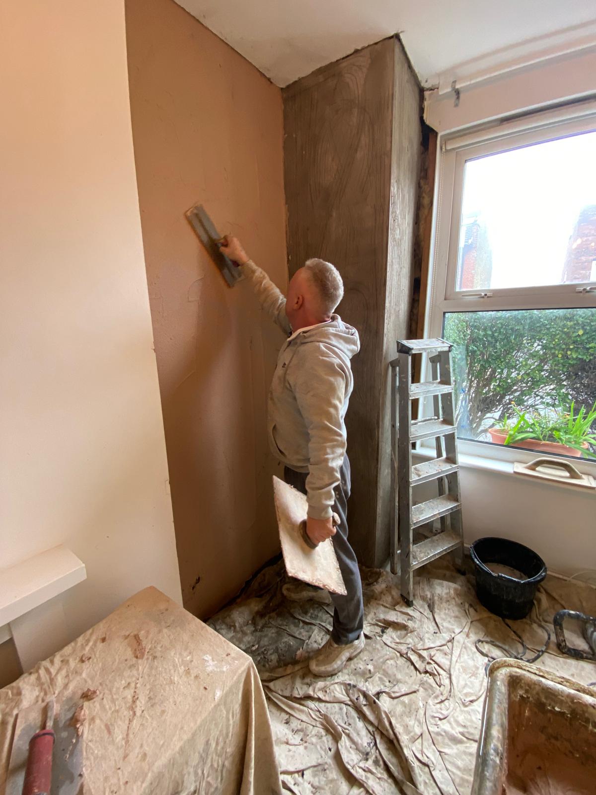 Jonathan Mills applying finish skim coat to internal wall in Epsom KT17, preparing surface for painting