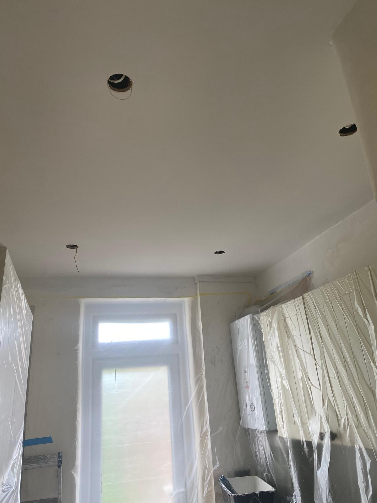 Smooth skimmed kitchen ceiling with downlighter positions cut out, Epsom home