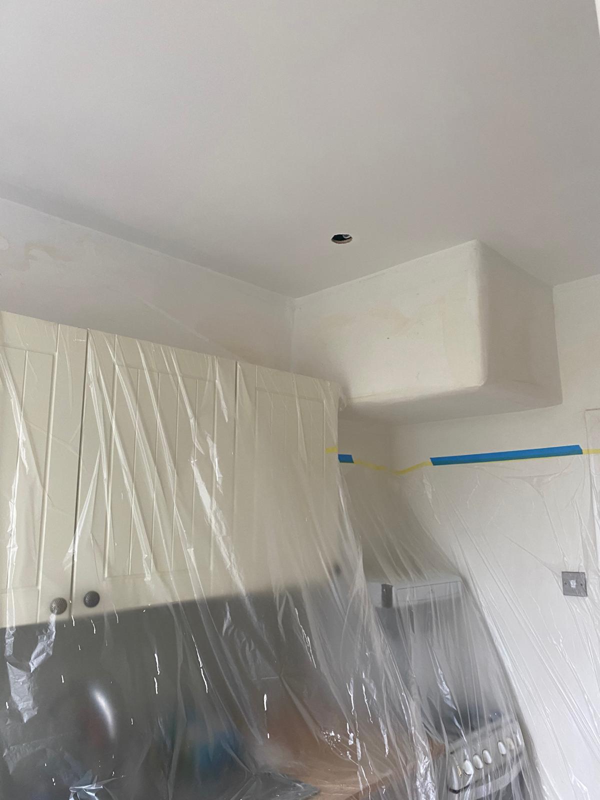 Plastered ceiling bulkhead with clean finish around kitchen units, Epsom Surrey