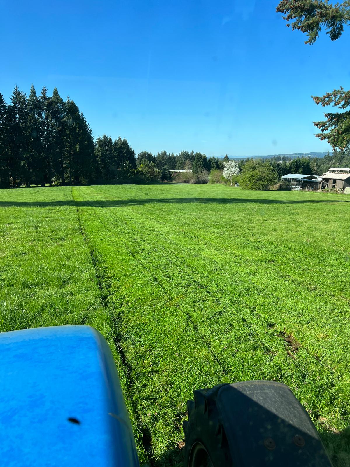 Field mowing with tractor completed by Metro Mowing Services and Maintenance LLC