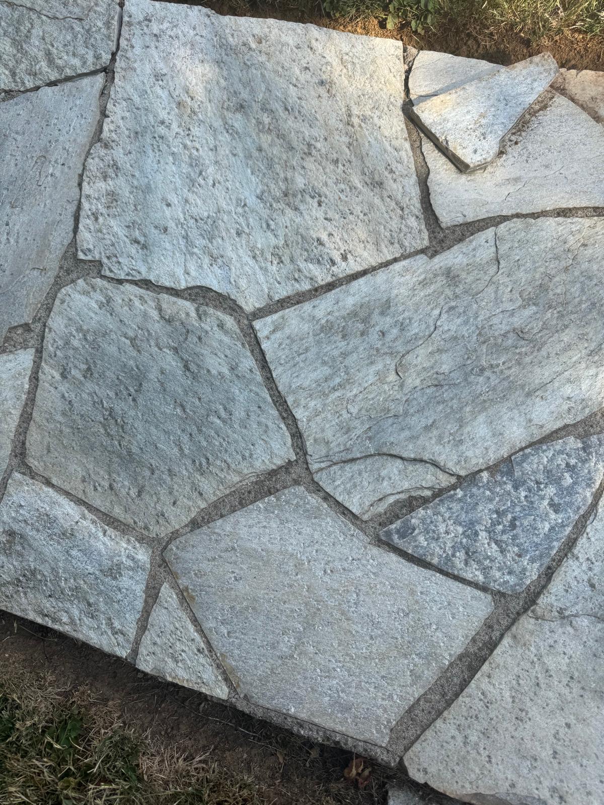 Flagstone patio close-up completed by Metro Mowing Services and Maintenance LLC