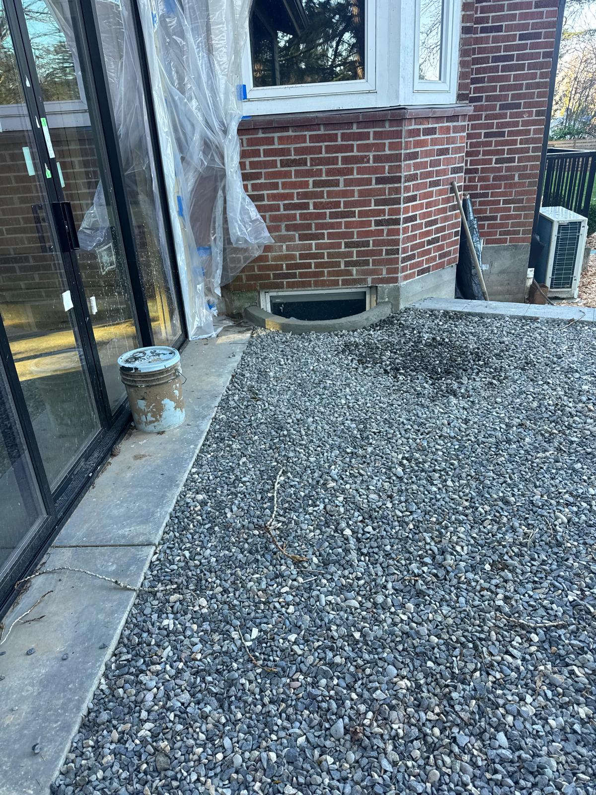 Gravel side yard beside house completed by Metro Mowing Services and Maintenance LLC
