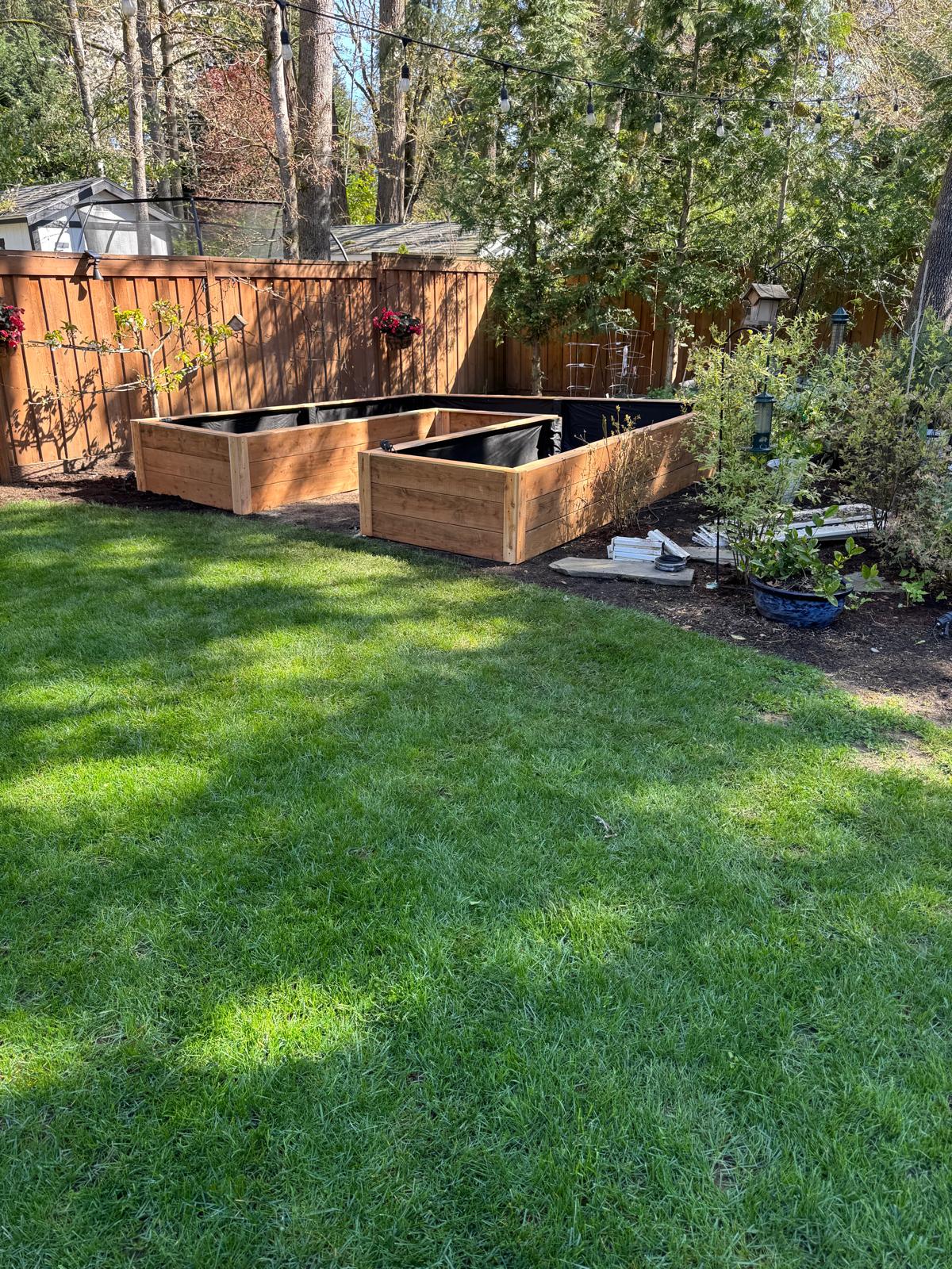 Cedar raised garden beds on lawn completed by Metro Mowing Services and Maintenance LLC