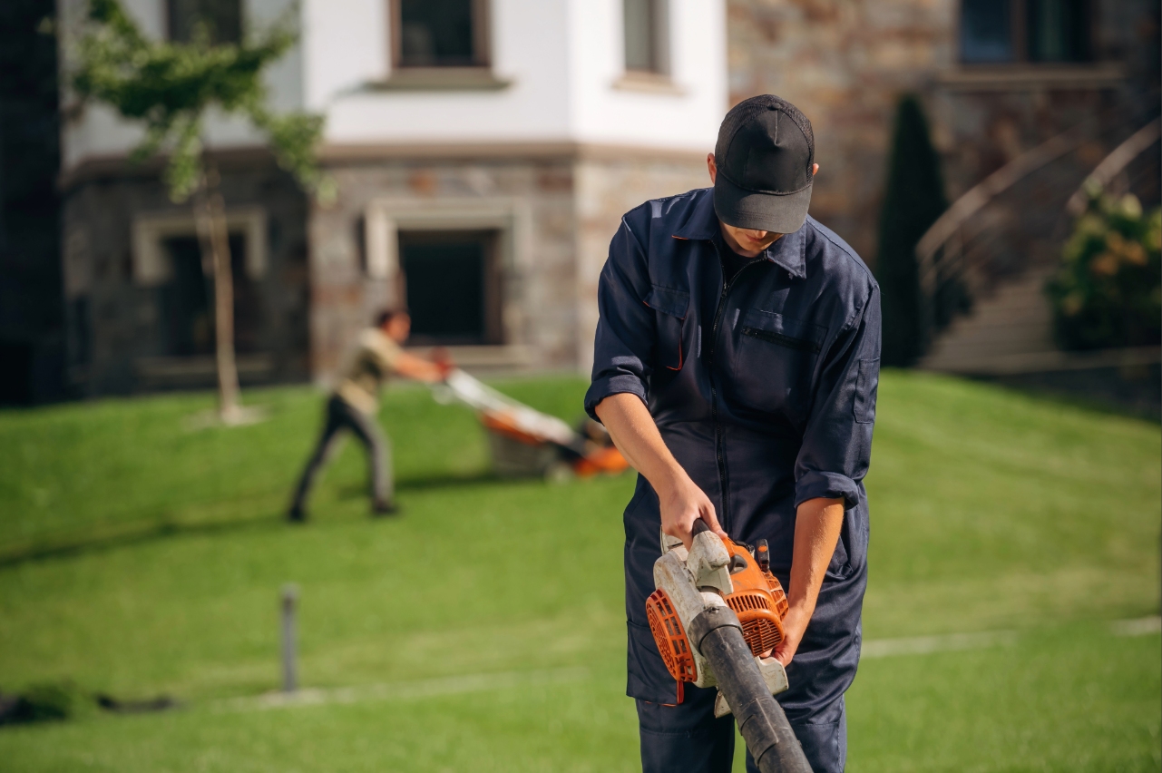 Professional lawn care team maintaining a residential property