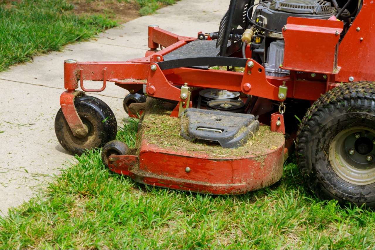Professional mowing and edging a residential lawn Professional mowing and edging a residential lawn