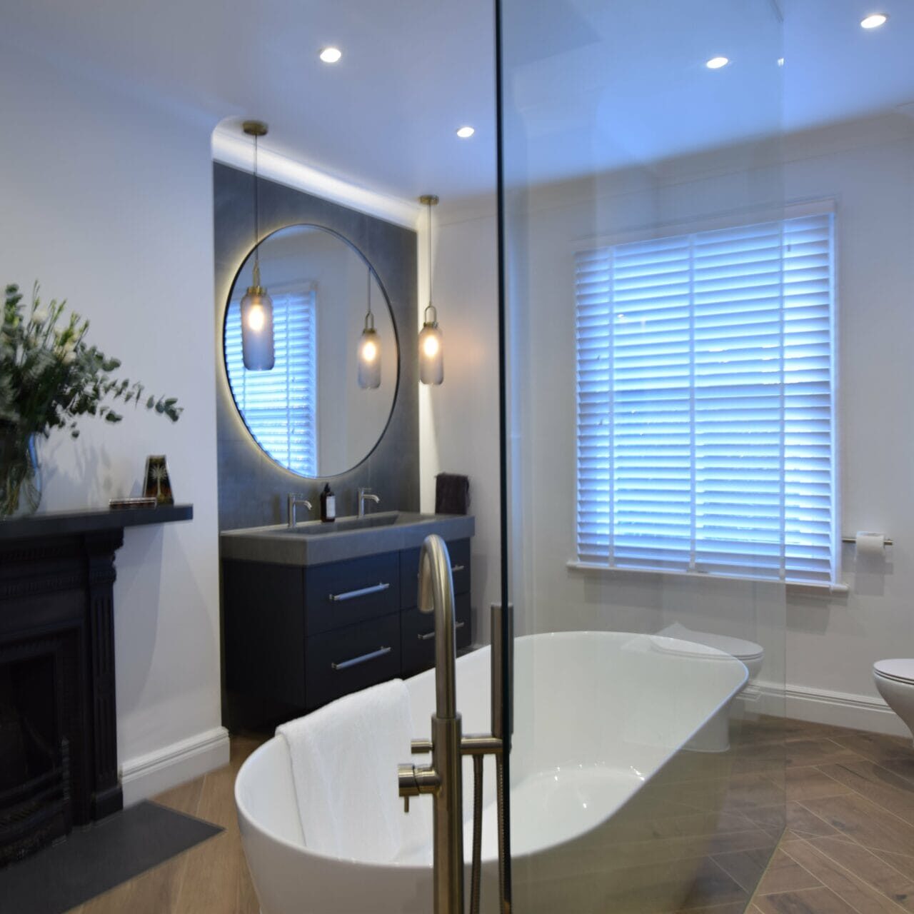 Vanity and herringbone floor in Bathford wet room