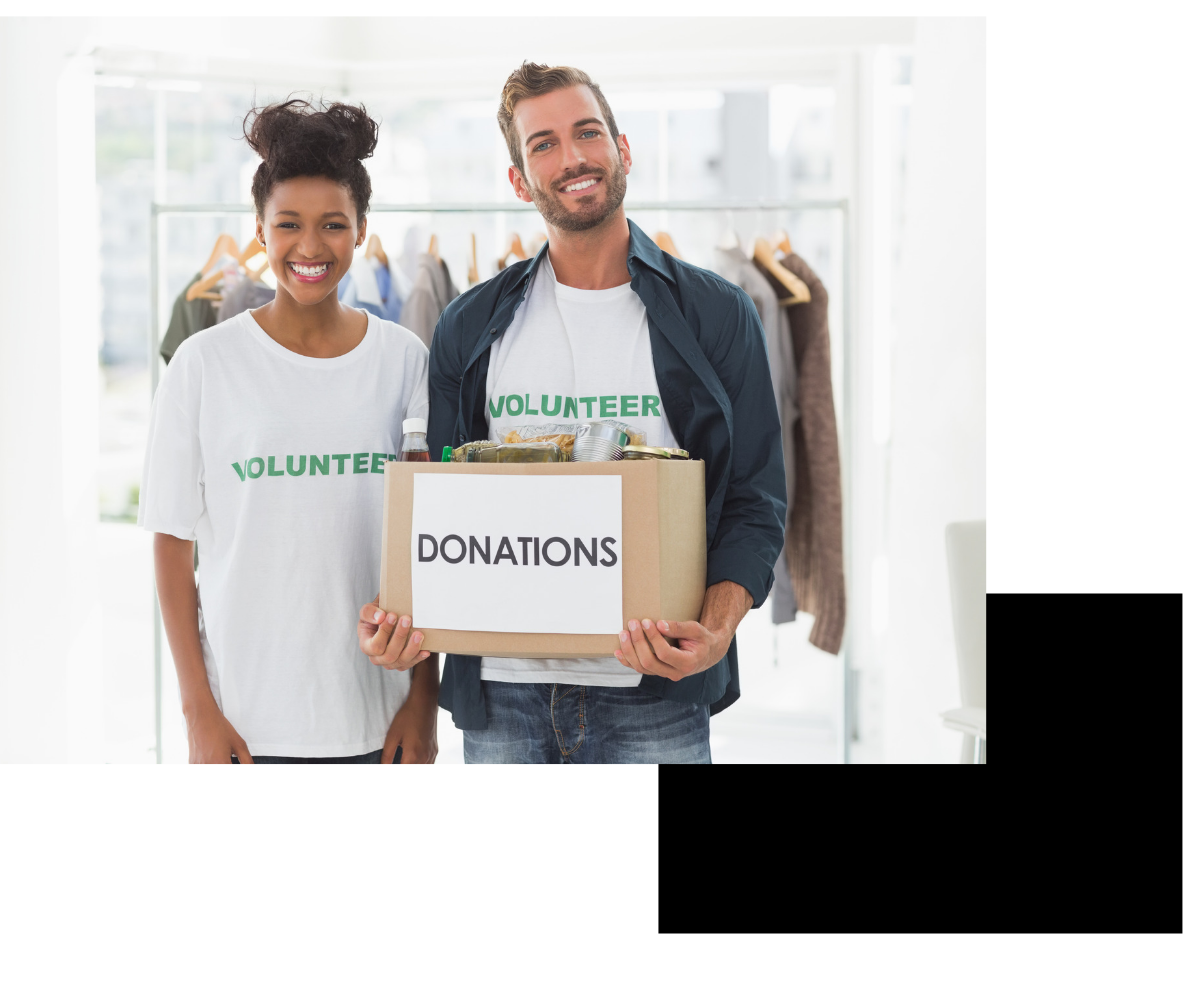 Volunteers holding a donations box