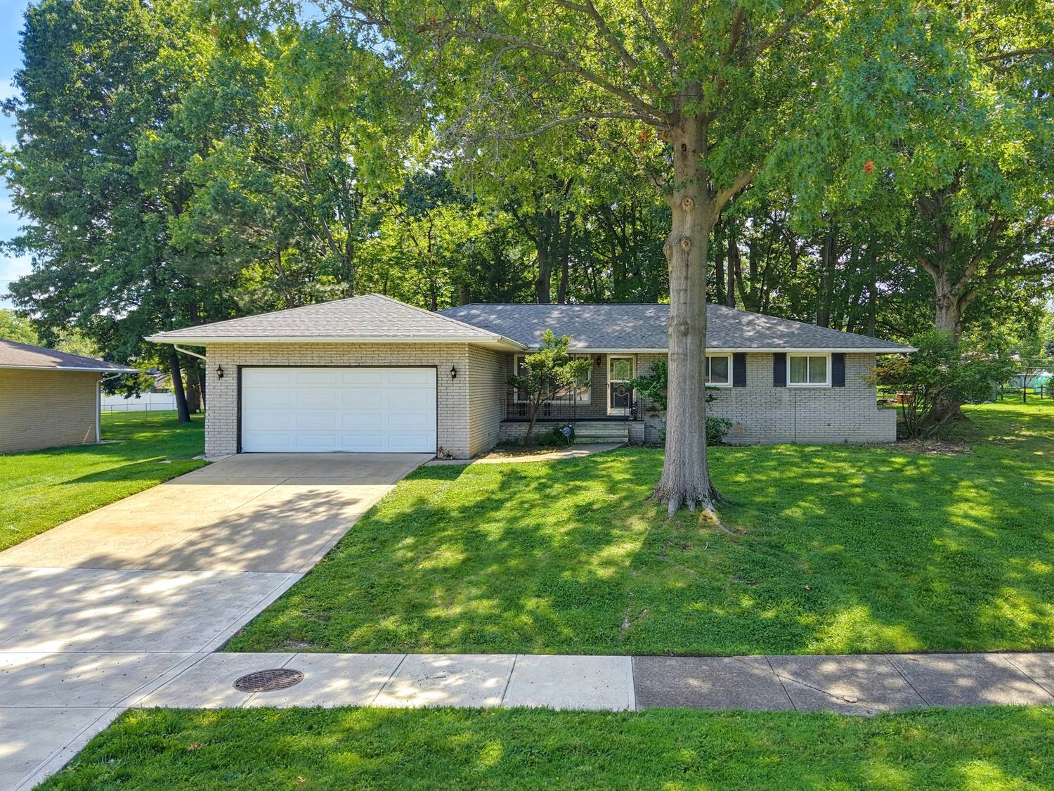 Front of 1780 E Parkhaven Drive, a full brick ranch with an attached two car garage