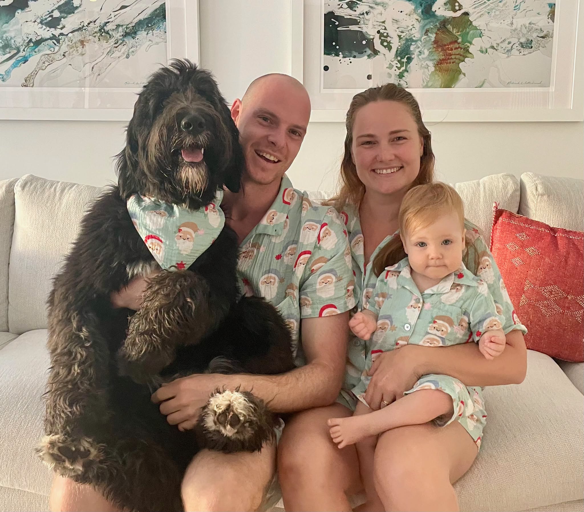 Amy and Michael with their daughter and dog at home