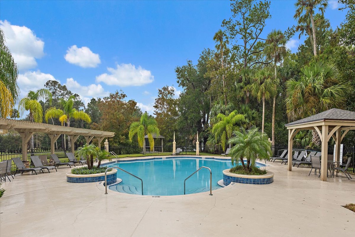 Community pool and pavered pool deck in Plantation Oaks
